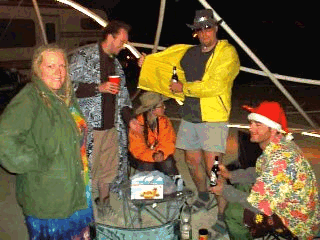 That's our human in the Santa Hat.  Rich actually signed for him.  That's Kat in the army jacket.  It was cold.  In the background are Rich, Barbara, and Greg.